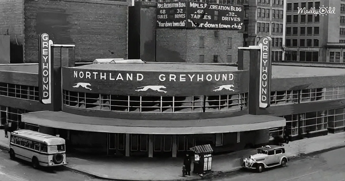 Northland Greyhound building with bus and car in front, vintage architecture.