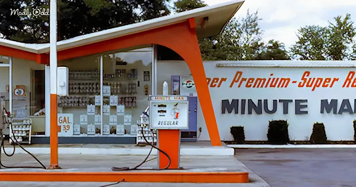 A vintage gas station with orange and white design, "Minute Man" sign, and retro gas pump.