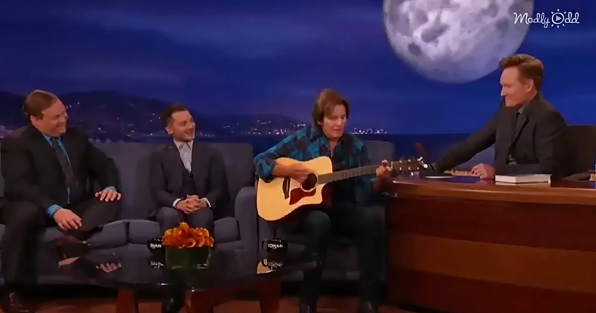 John Fogerty singing "Have You Ever Seen the Rain”