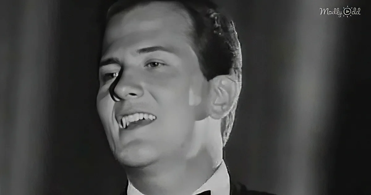 A man in a suit smiles with a unique, possibly edited, appearance.