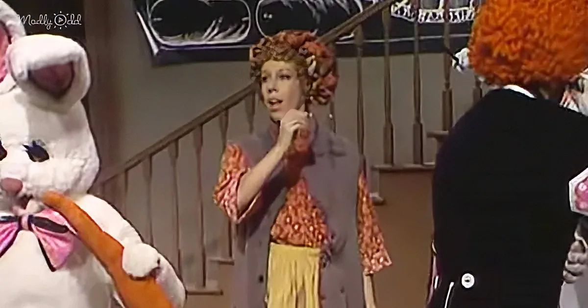A woman in a red polka-dot shirt and yellow skirt stands between a person in a white bunny costume and another in a black...