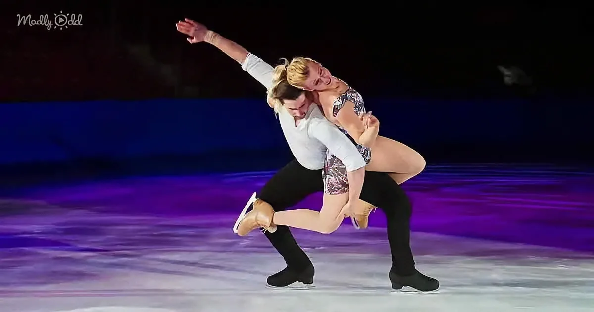 A figure skating couple performs a dramatic pose on the ice, showcasing their skill and artistry.