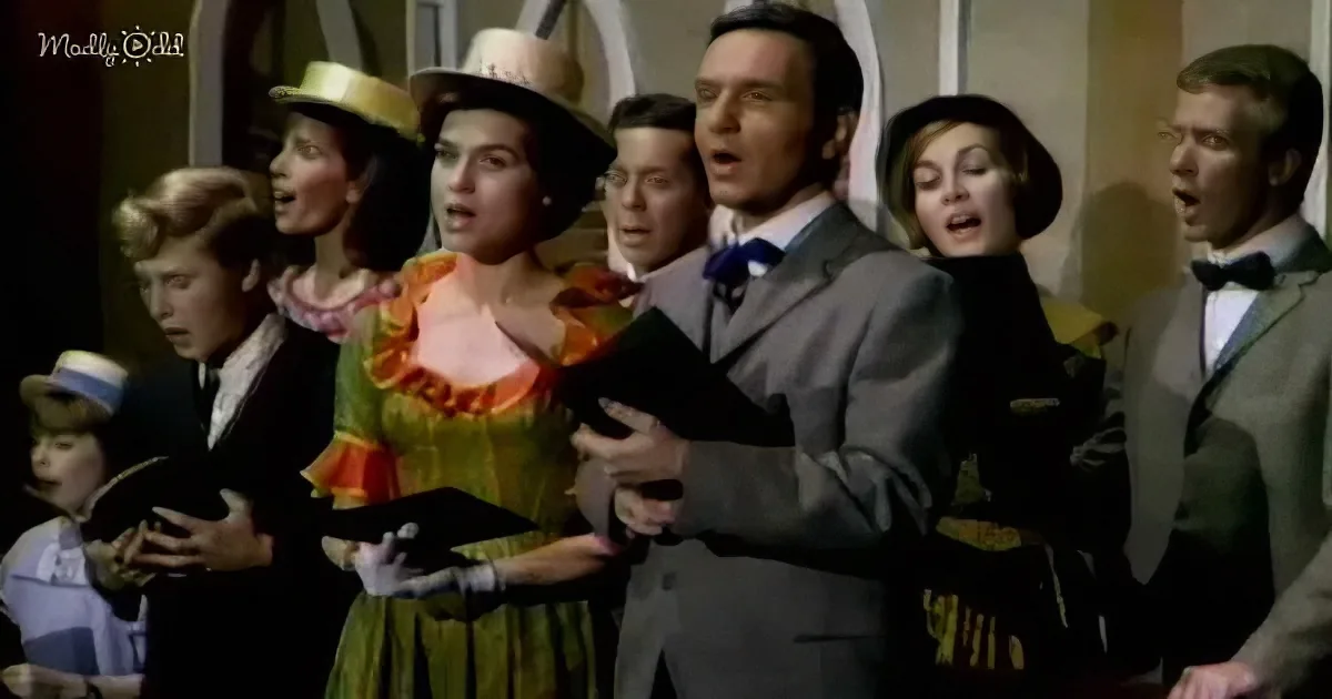 A group of people in vintage attire sing together, holding black books, in a choir-like setting.