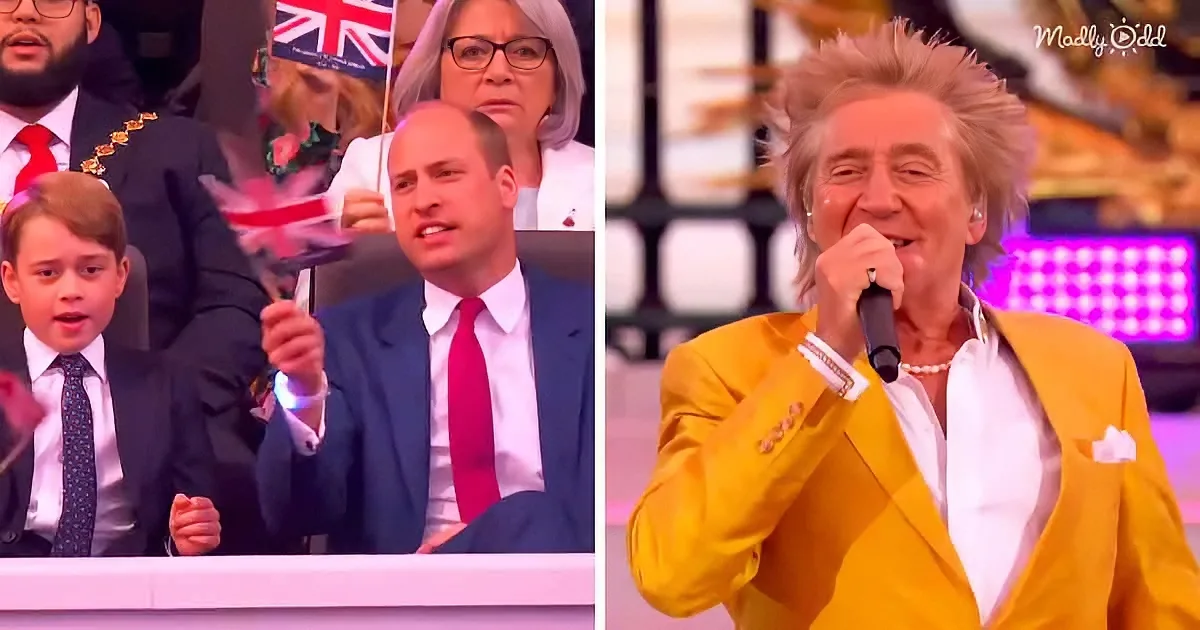 Prince William and a man in a yellow suit are seen at a public event, with the man singing into a microphone.
