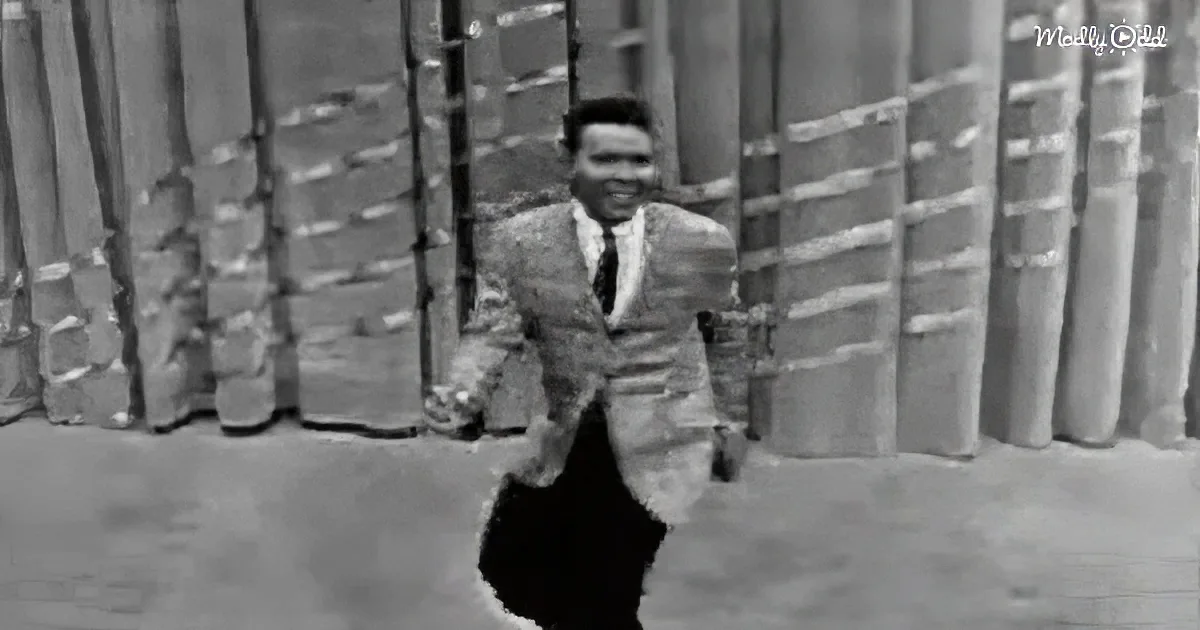 A man in a suit and tie is running, holding a briefcase, with a blurred background of stacked barrels.