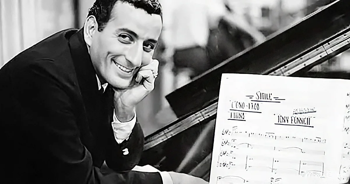 A smiling man leans on a piano, holding sheet music titled "Smile" by Tony Bennett.