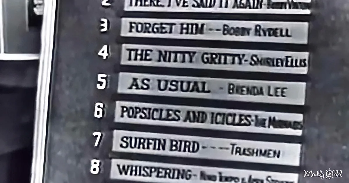 A vintage jukebox display shows song selections including "The Nitty Gritty" and "Surfin' Bird."