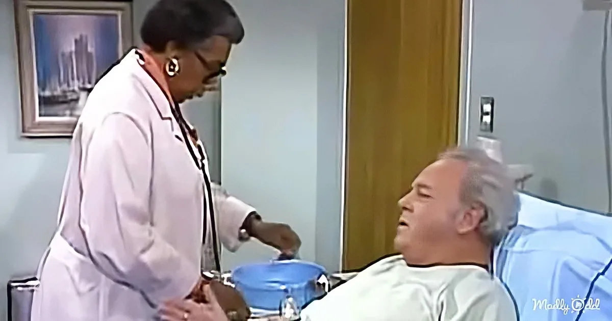 A doctor in a white coat stands beside a patient in a hospital bed, holding a stethoscope.