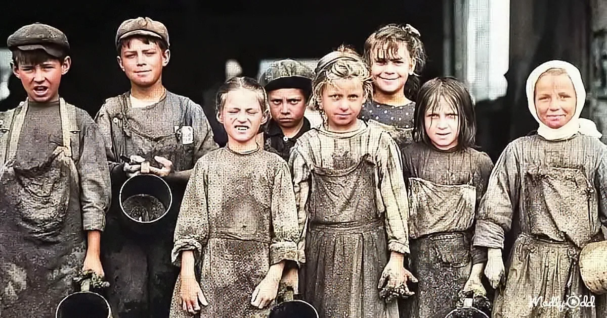 Children in soiled work clothes, some with pails, stand together, likely from a historical labor scene.