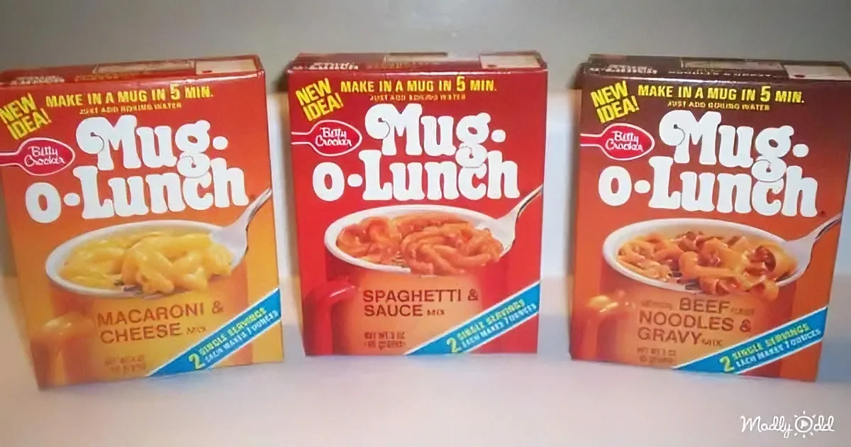 Three boxes of Betty Crocker Mug-O-Lunch featuring macaroni & cheese, spaghetti & sauce, and beef noodles & gravy.