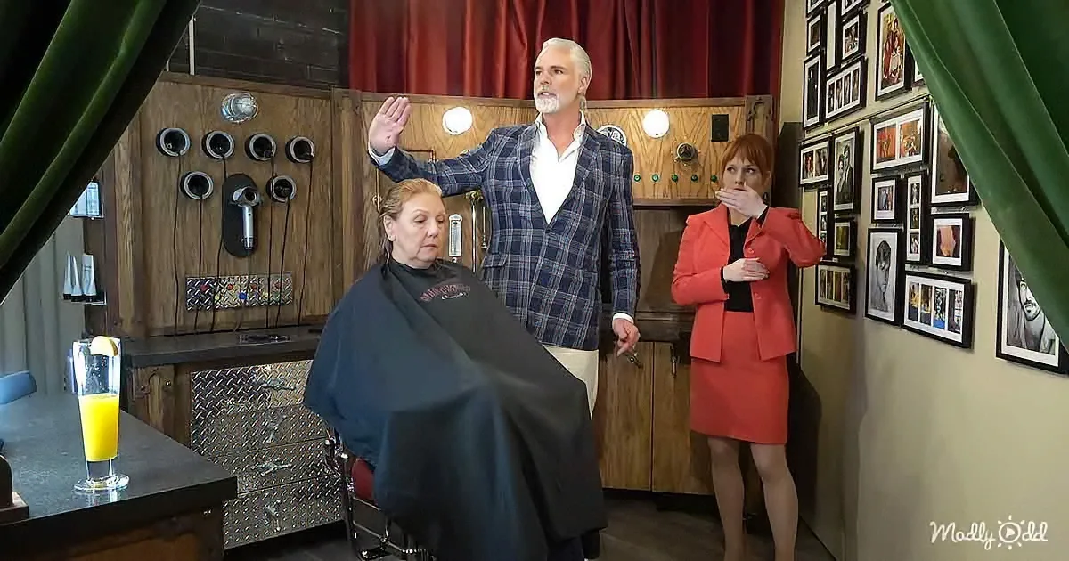 A man in a plaid jacket raises his hand, a woman in a red suit covers her mouth, and a seated woman in a salon chair...