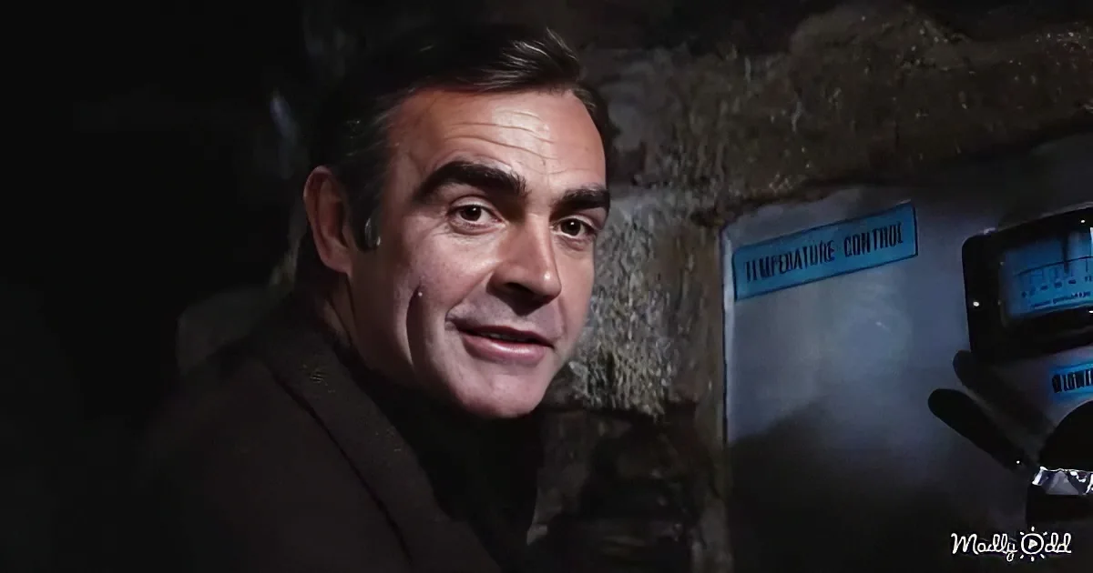 A man in a dark suit appears distressed, with a temperature control panel in the background.