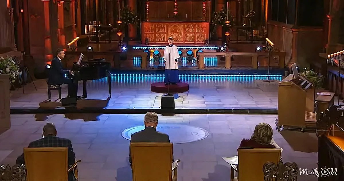 A pianist and a soloist perform on stage in a grand church setting with ornate decorations.