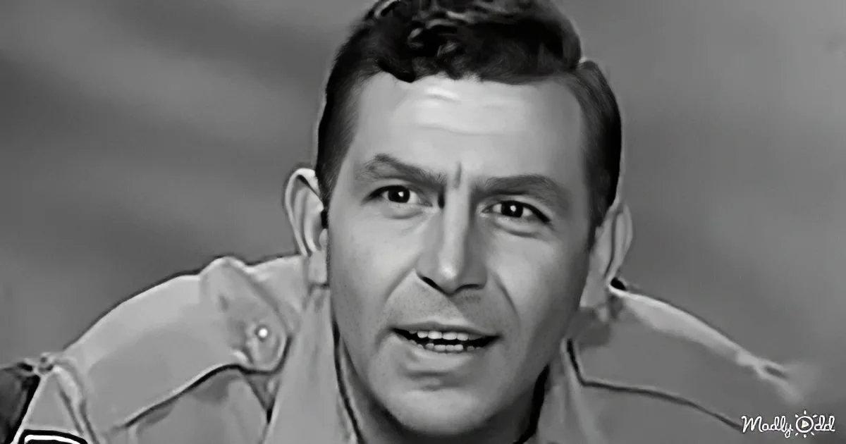 A man in a uniform with a serious expression, possibly from a film or television show.