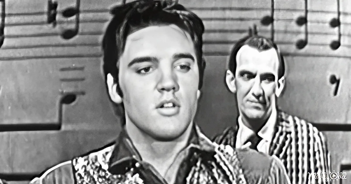 Elvis Presley sings passionately, wearing a patterned shirt, with musical notes in the background.