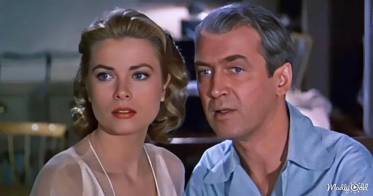 A woman with blonde hair and a man in a blue shirt are seated together, looking concerned.