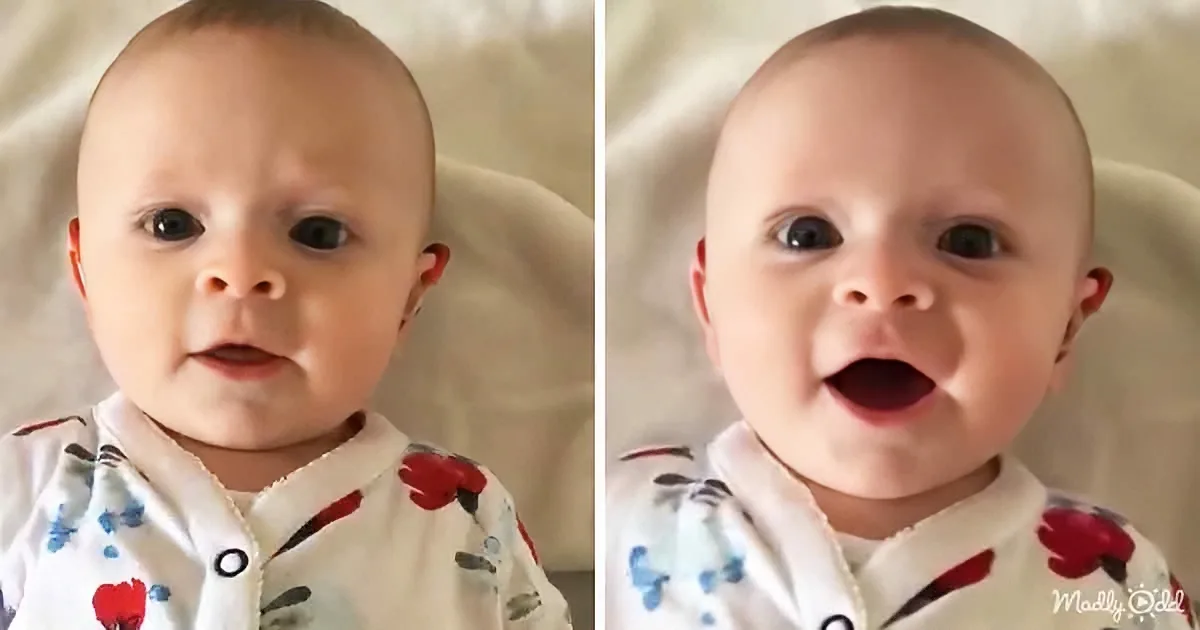 A baby in a floral onesie smiles widely in two consecutive close-up shots.