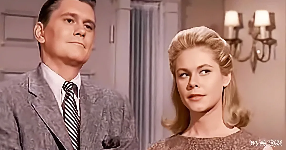 A man in a suit and tie stands beside a woman with blonde hair in a vintage setting.