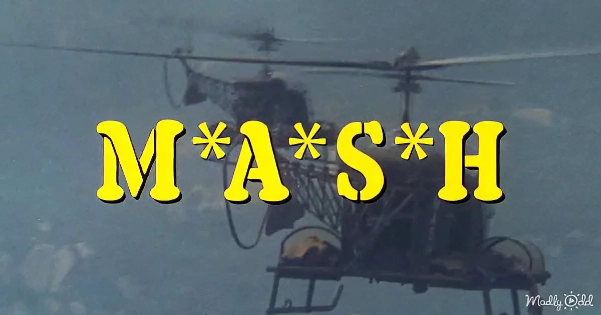A helicopter with the text "M*A*S*H" overlaid in yellow against a blue sky background.