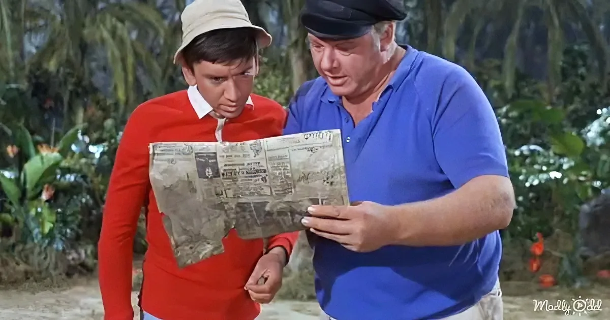 Two individuals, one in red and one in blue, examine a map in a lush, tropical setting.