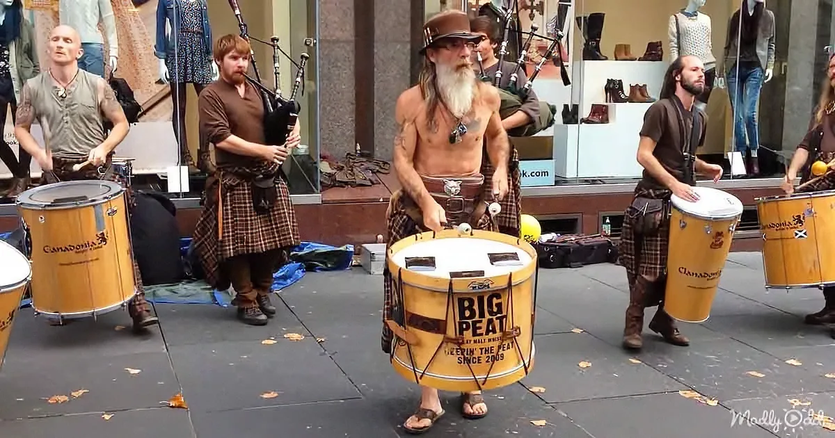 Scotsmen performing bagpipe and drum music
