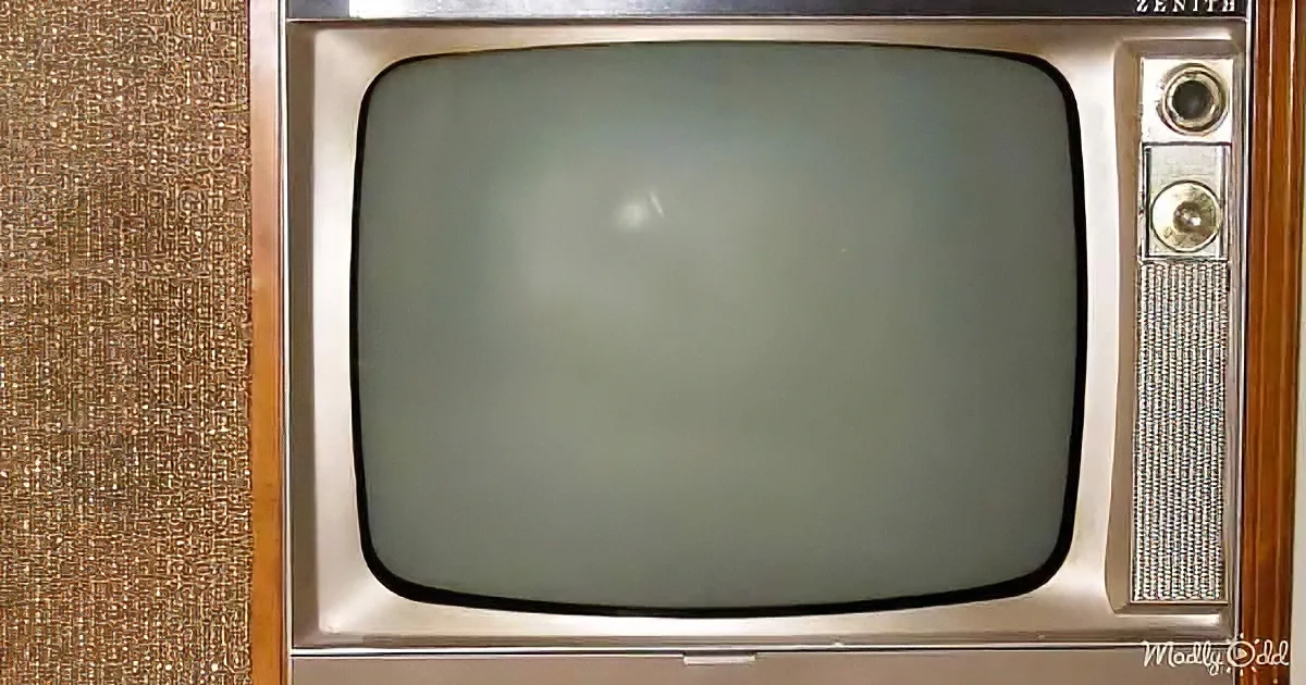 An old Zenith television set with a blank screen and wooden paneling.