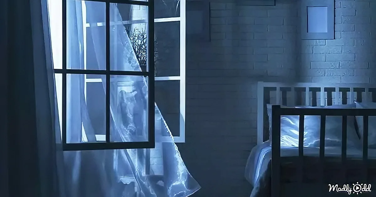 A ghostly figure appears behind a window, draped in sheer curtains, with a crib in the foreground.