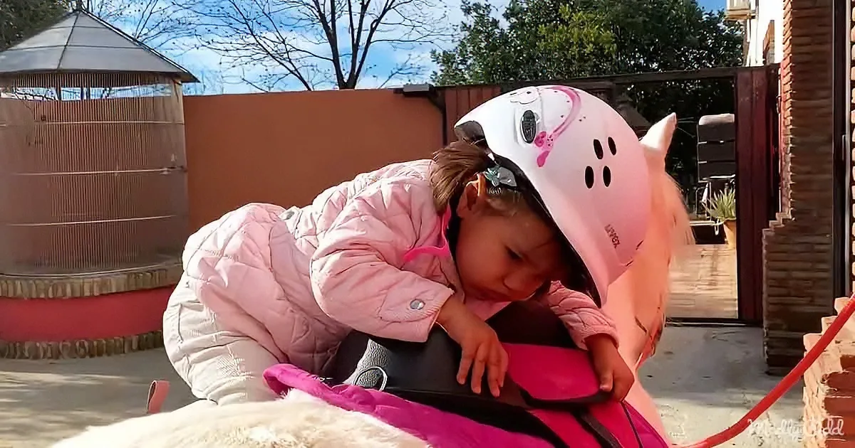 Toddler loves horse riding