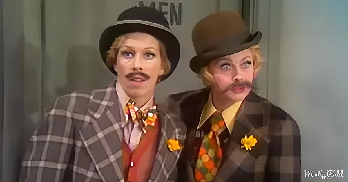 Two individuals in plaid suits and hats, one with a bow tie, appear surprised or confused.