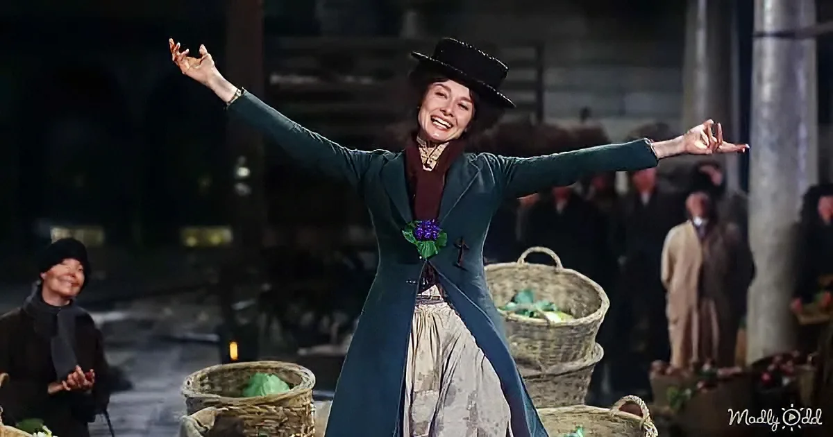 A woman in a green coat and hat dances joyfully in a bustling market scene.