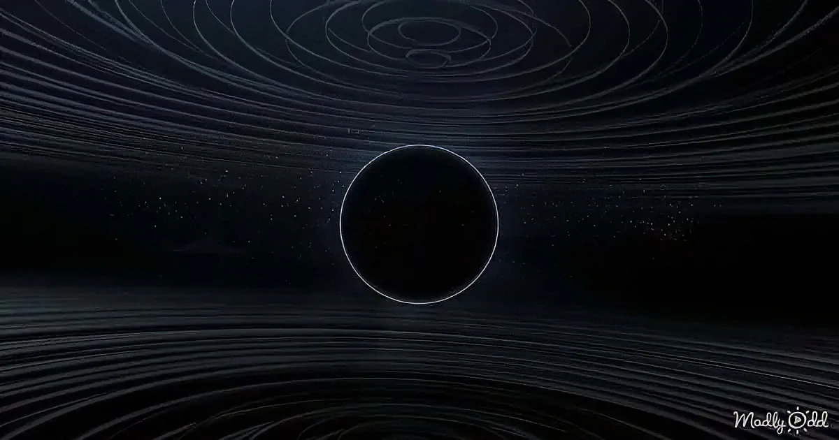 A black sphere surrounded by concentric, rippling lines against a dark, starry background.