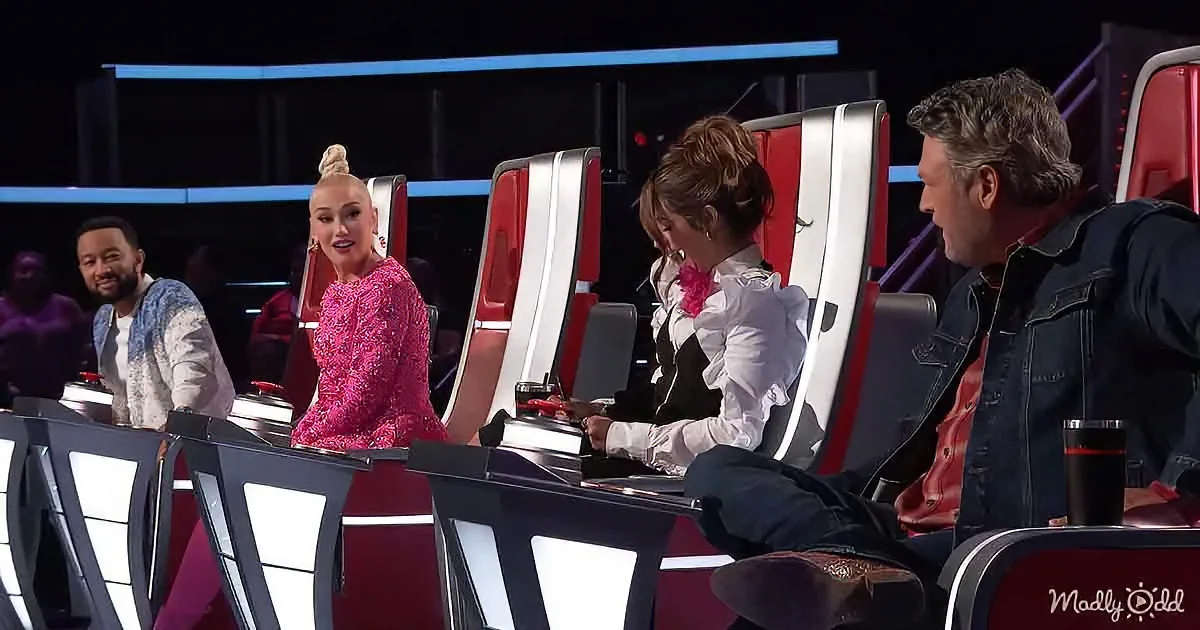 Four judges sit on red chairs in a studio, with one in a pink dress and another in a white shirt.