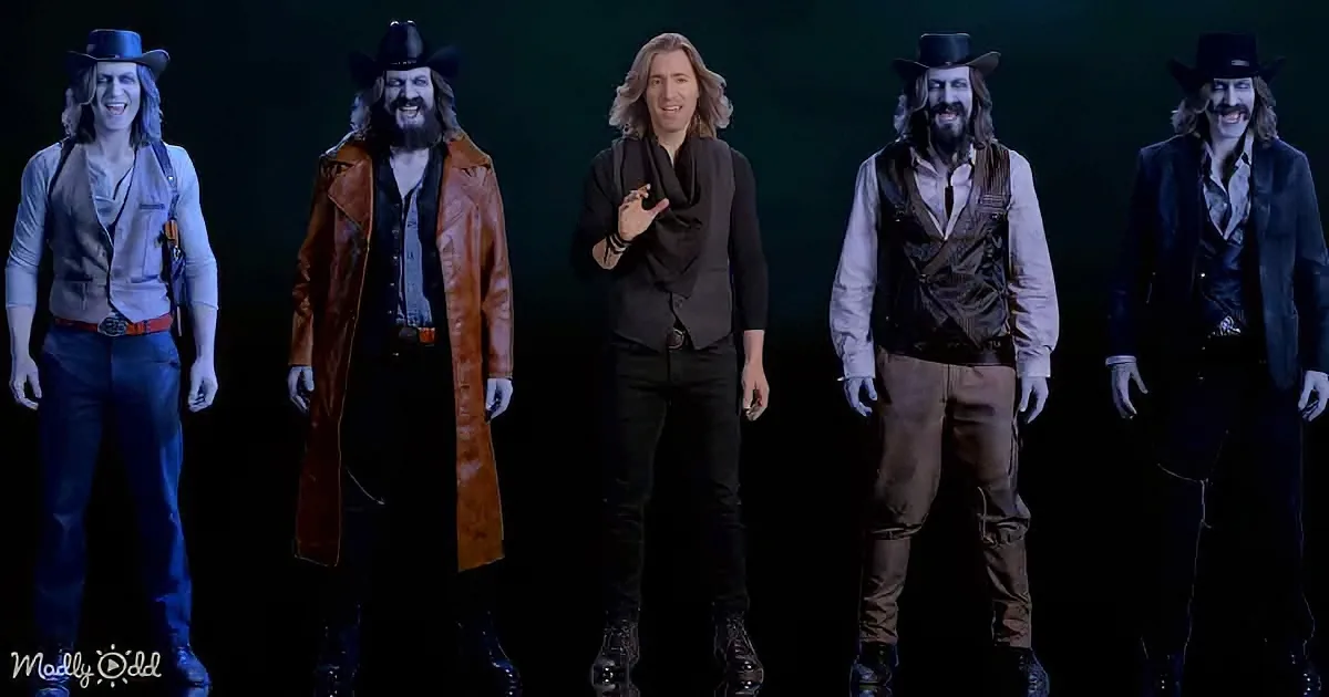 A man in a brown leather coat and cowboy hat stands among five others in western attire against a dark background.