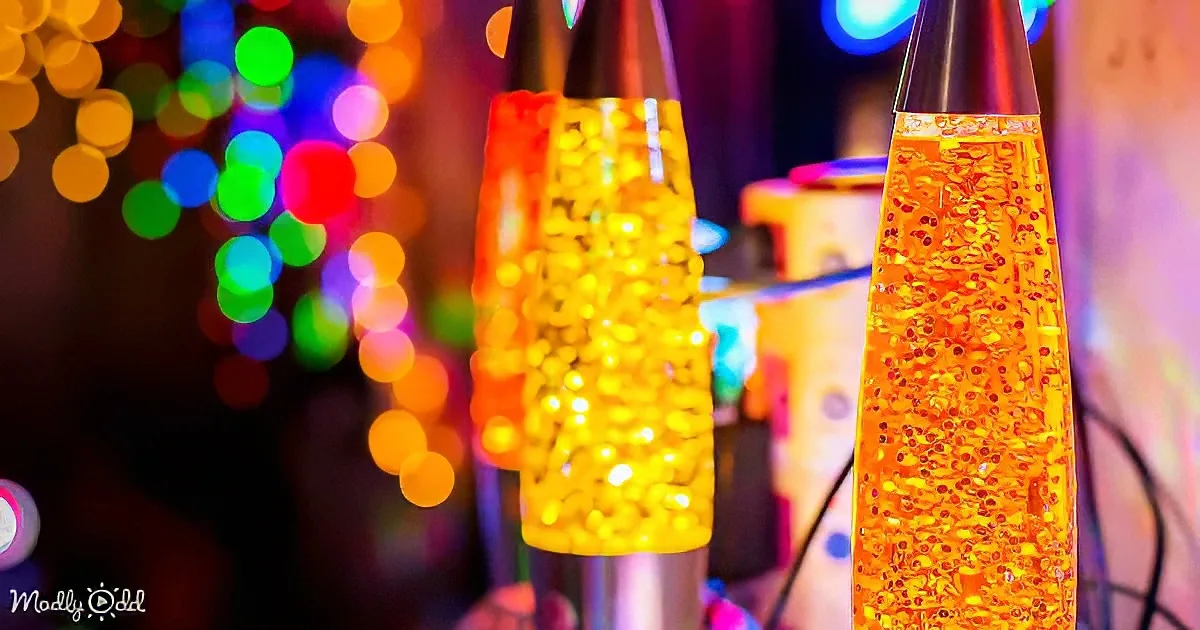 Two lava lamps with glowing yellow beads, surrounded by colorful bokeh lights in the background.