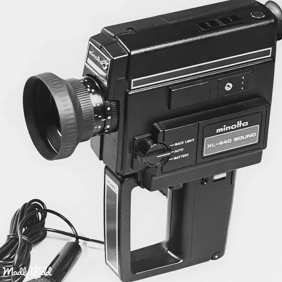 A Minolta XL-440 Sound video camera with a lens, handle, and power cord is shown.