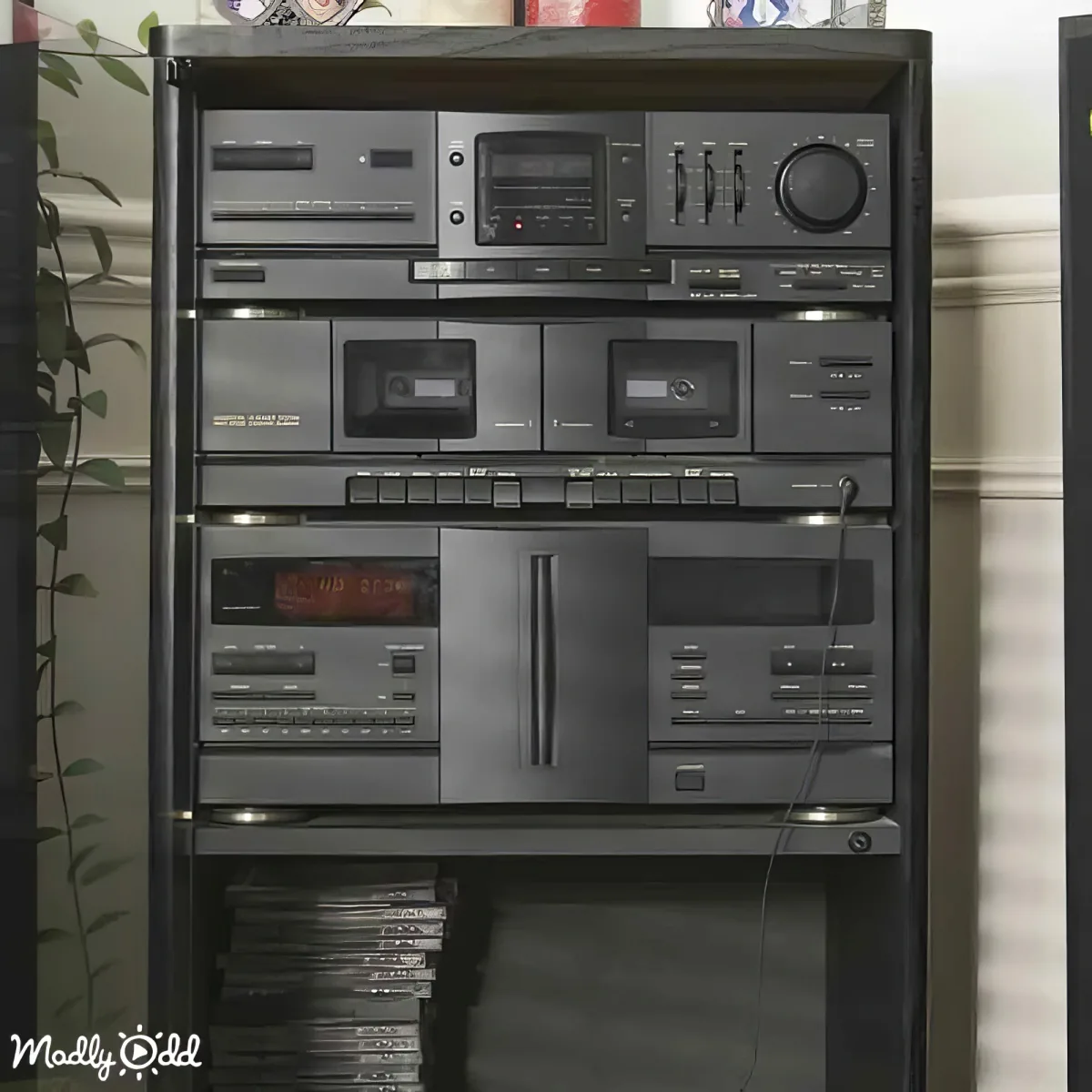 A vintage stereo system with cassette decks, CD player, and radio is displayed on a black stand.