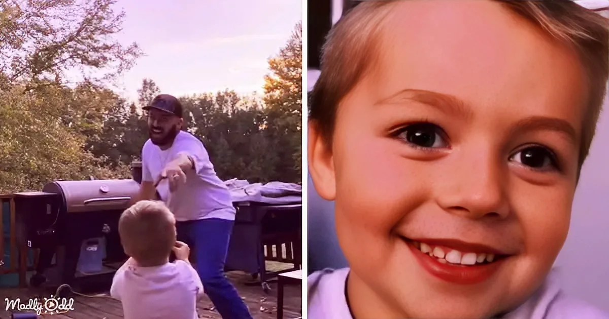 A man in a white shirt and cap is cooking outdoors, smiling, with a child in the foreground.