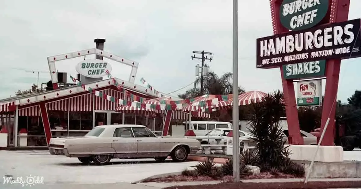 A vintage Burger Chef restaurant with classic cars and striped awnings.
