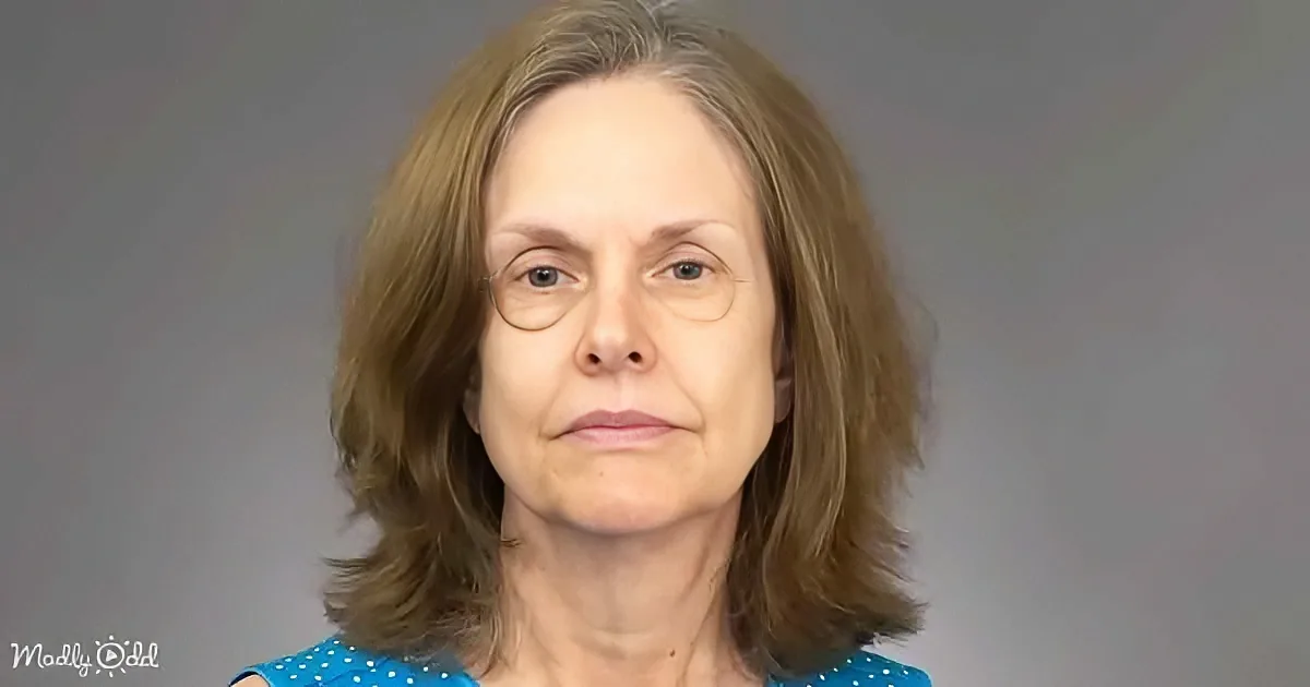 A woman with shoulder-length brown hair and a blue polka-dot top is seen against a plain background.