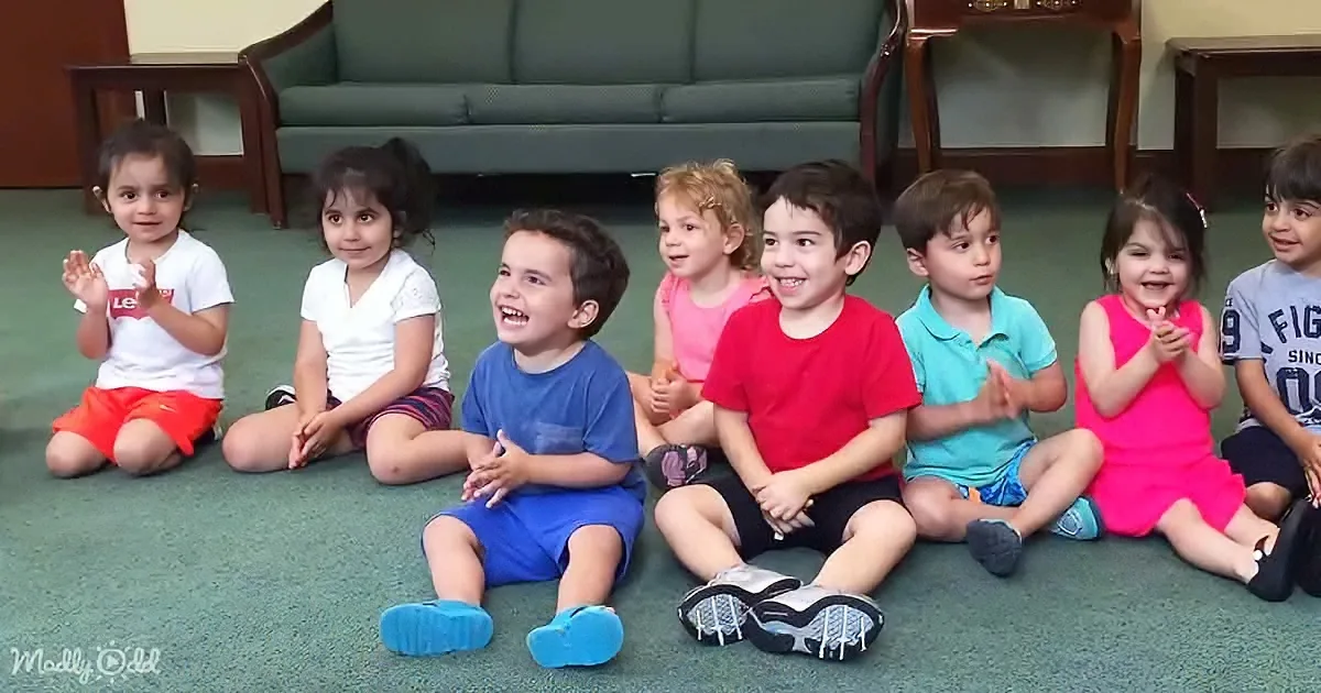 Giggling Toddler Cracks up Class While Singing 'Clap Your Hands'