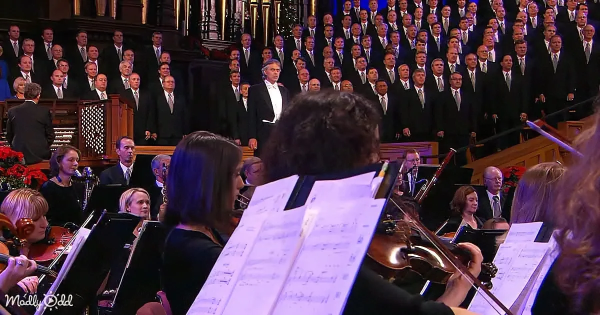 Conductor leads orchestra and choir in a grand performance.