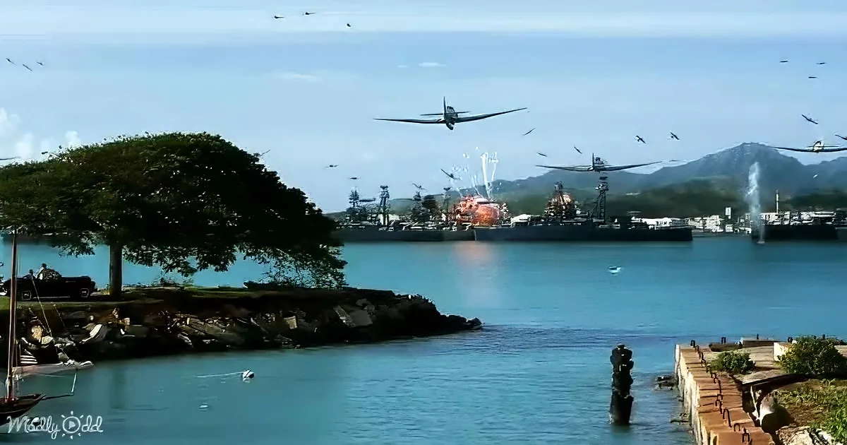 A plane flies over a harbor with ships, explosions, and a tree-lined shore.