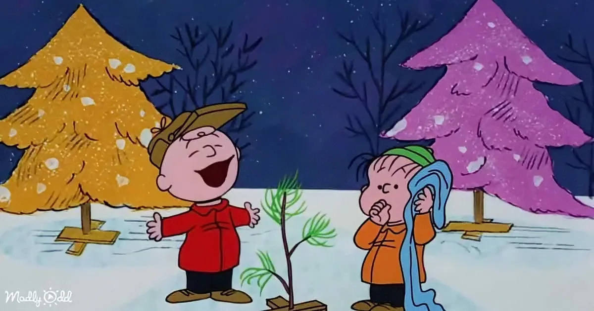 Charlie Brown and Linus are in a snowy scene, with Charlie Brown smiling and Linus holding a blanket.