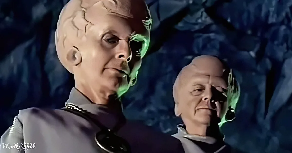 A man in a uniform with a greenish glow around his head and another man in the background.
