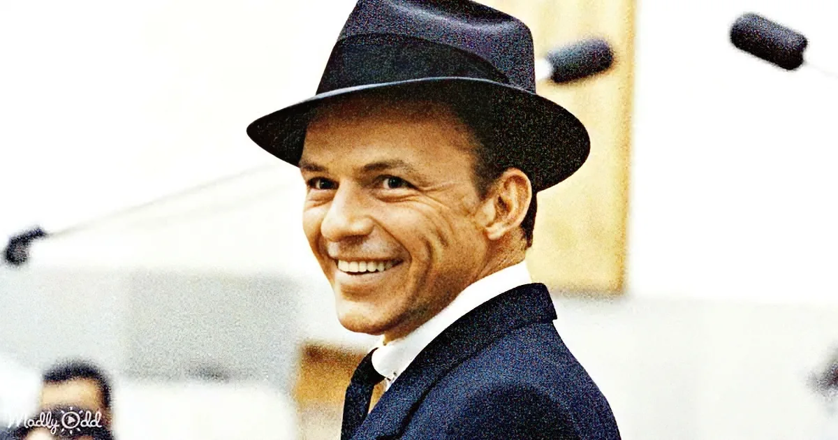 Frank Sinatra smiles in a suit and fedora, with a blurred background and a "Madly Odd" watermark.
