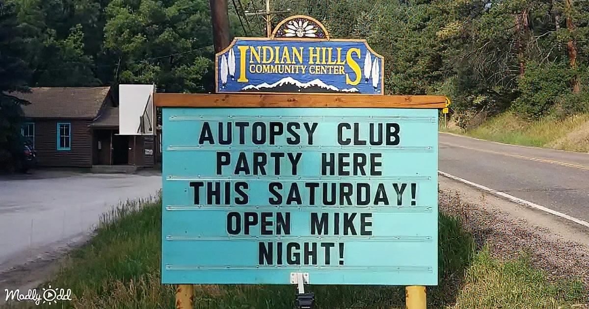 A sign at Indian Hills Community Center advertises an "Autopsy Club Party" with "Open Mike Night" this Saturday.