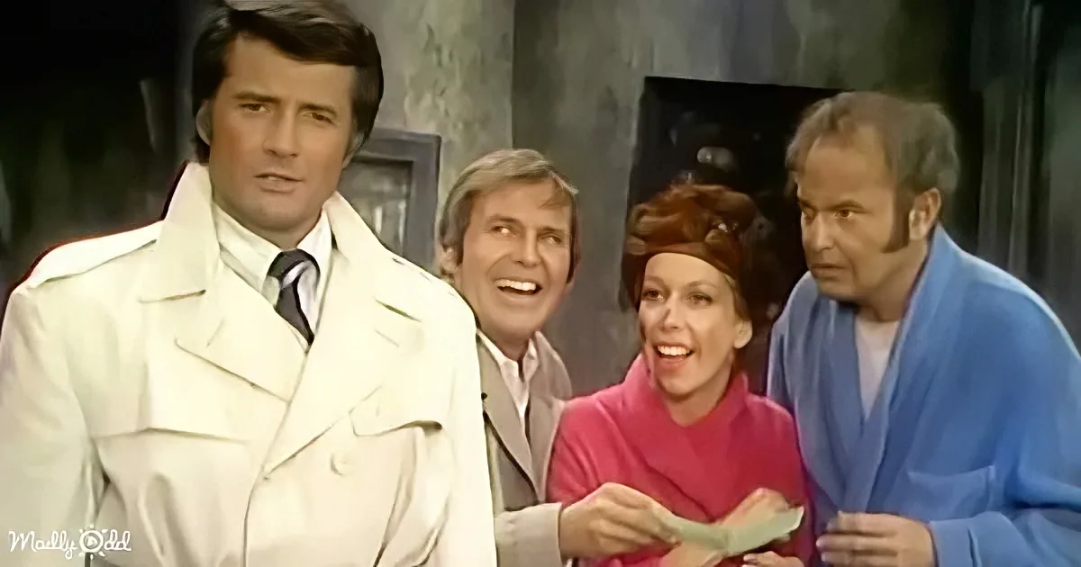 A man in a white trench coat stands with three others, one holding money, in a vintage setting.