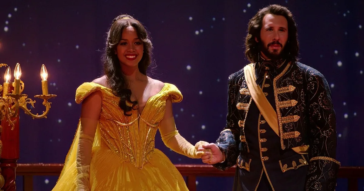 A woman in a yellow dress and a man in a blue suit sing passionately on stage.
