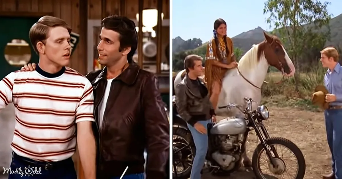 A man in a striped shirt is being embraced by another man in a leather jacket, while a woman on a horse and others stand...