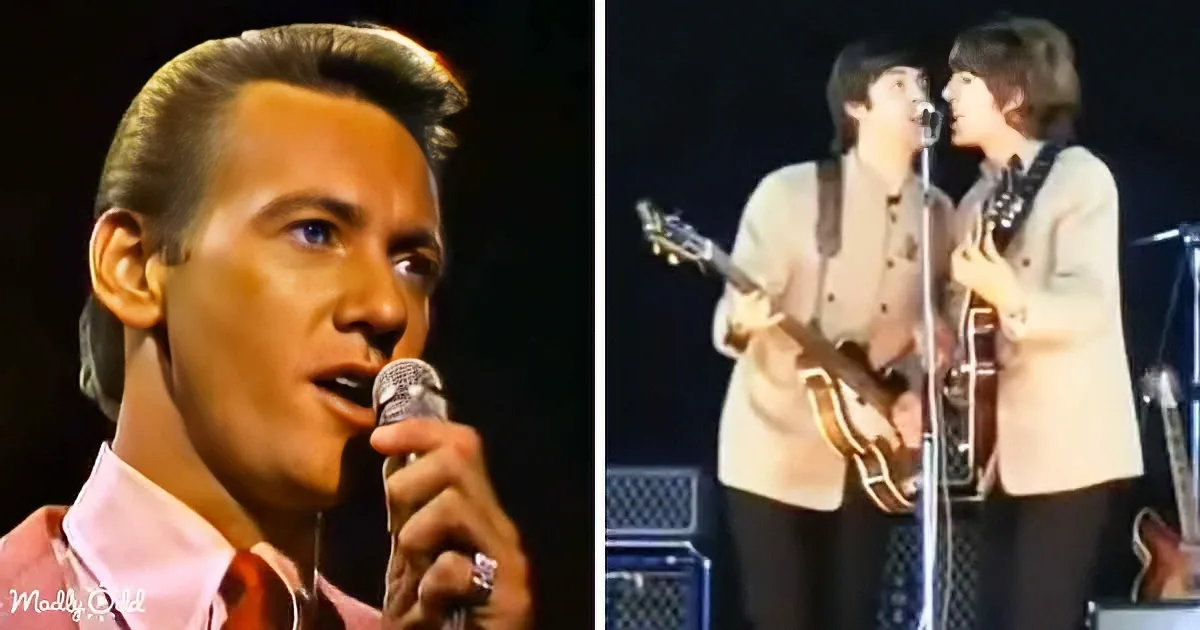 A man in a pink shirt sings into a microphone, while two musicians in white jackets play guitars on stage.